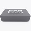 Rectangular concrete fire pit table with lit flame and ceramic spheres, front view
