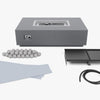 Cooking set components laid out: ceramic spheres, cast iron griddle plates, splatter guard and gas hose