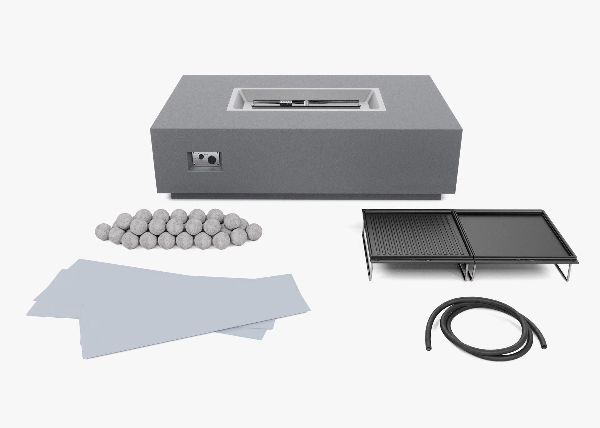 Cooking set components laid out: ceramic spheres, cast iron griddle plates, splatter guard and gas hose