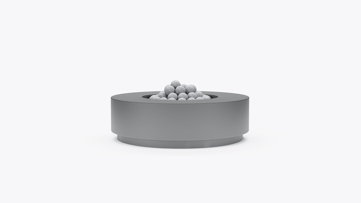 Round concrete fire pit table in gray finish with lava rocks, front view