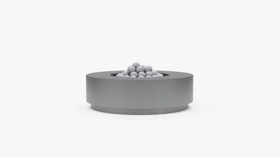 Round concrete fire pit table in gray finish with lava rocks, front view