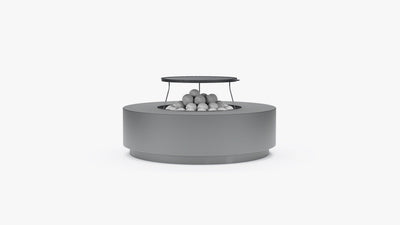 Round concrete fire pit table with cast iron grill grate and lava rocks, front view