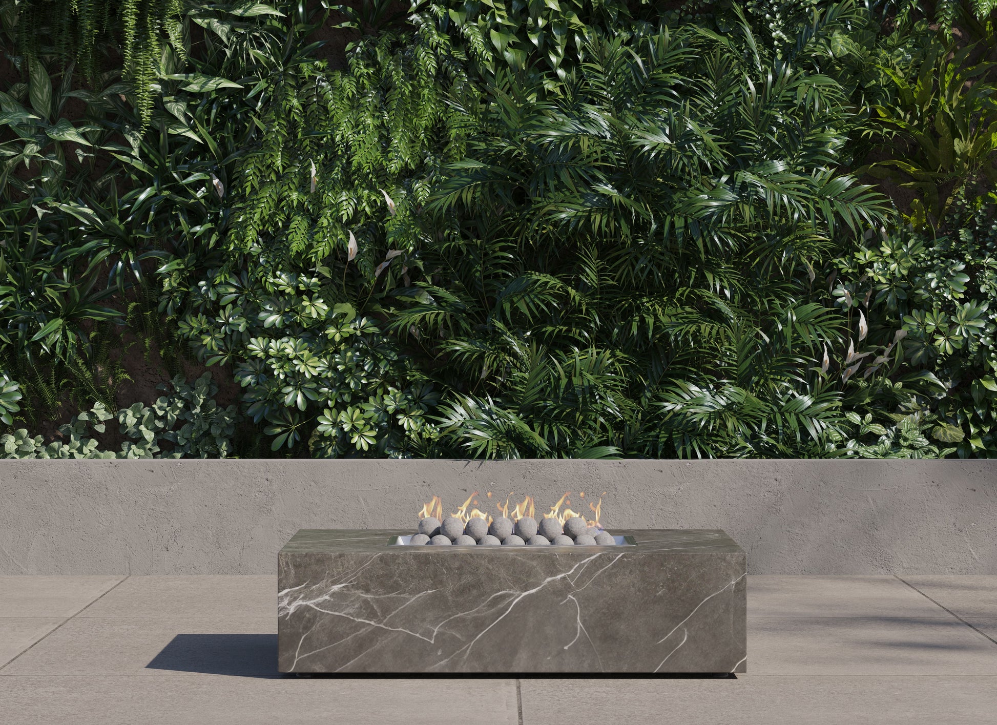 OuterStone rectangular fire pit table lit on a patio at dusk