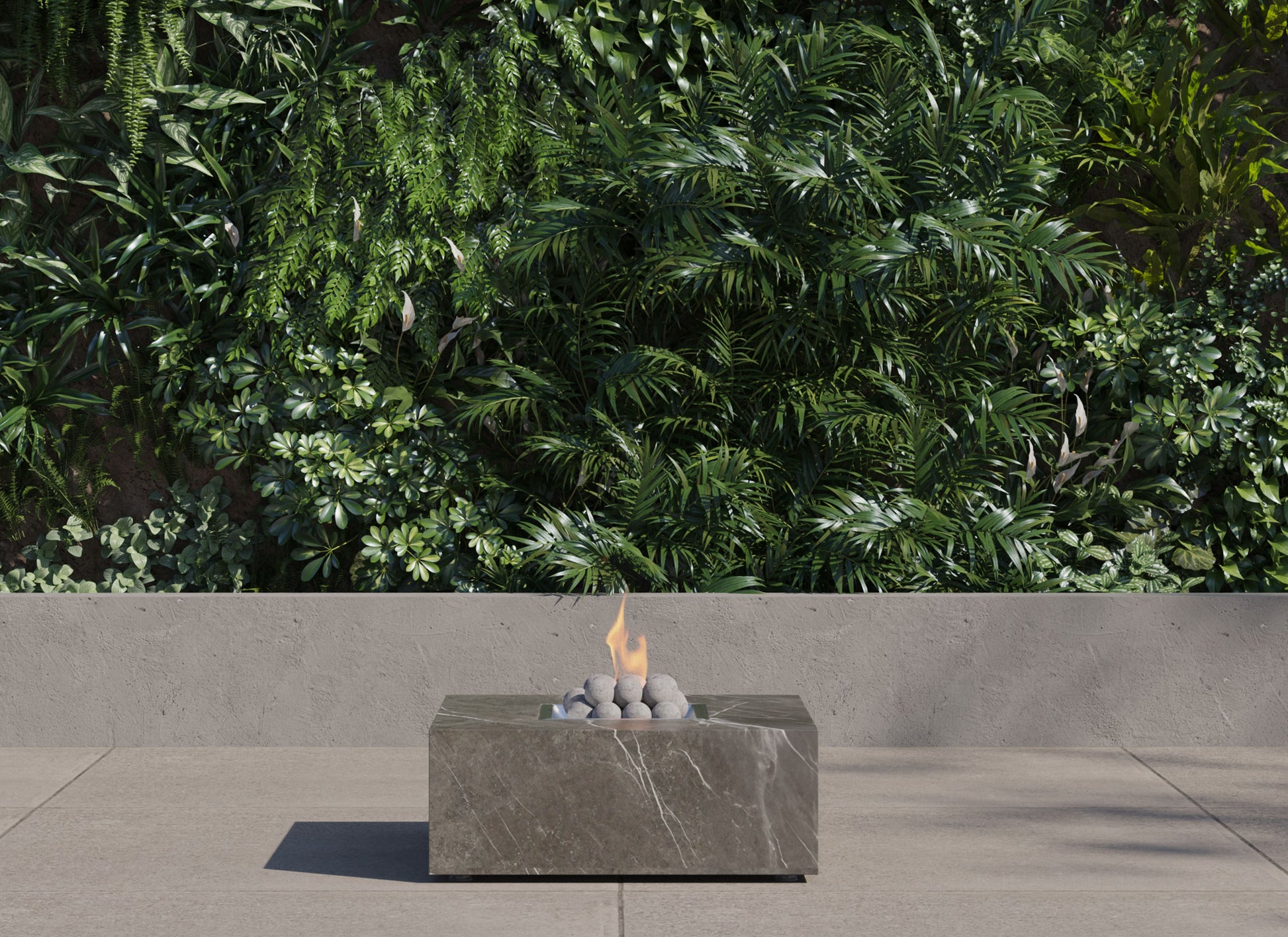 Square OuterStone fire pit table lit on a patio at dusk