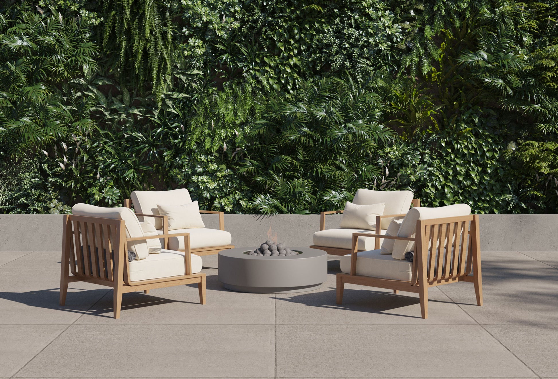 Round concrete fire pit table lit in a garden seating area at dusk