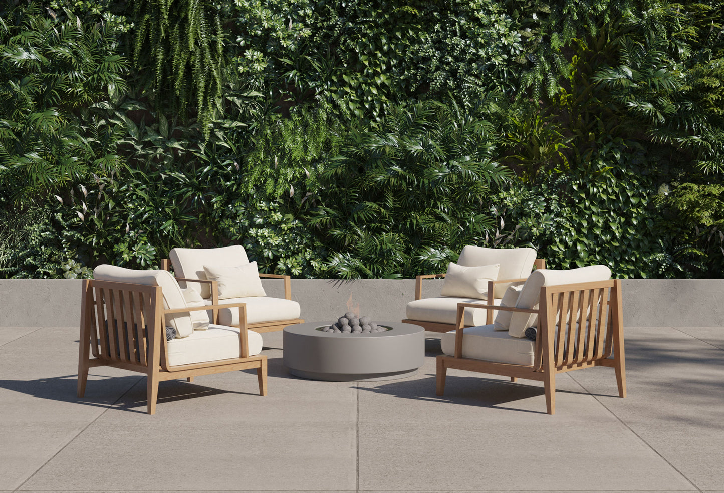 Round concrete fire pit table lit in a garden seating area at dusk