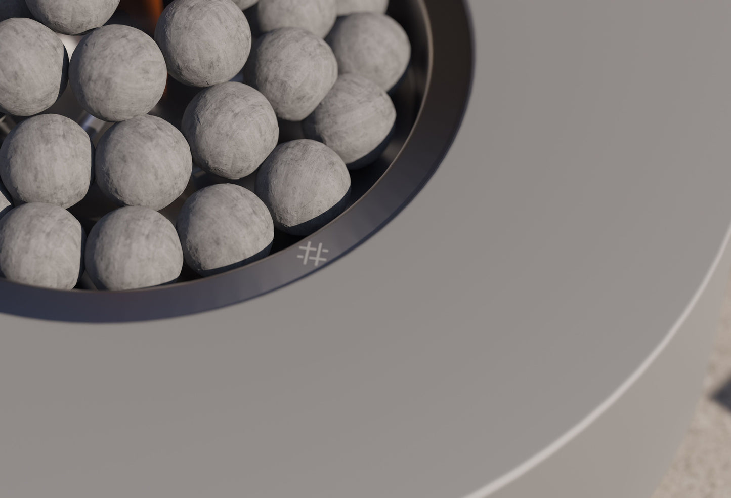 Close-up of the flame and ceramic spheres in the round burner pan