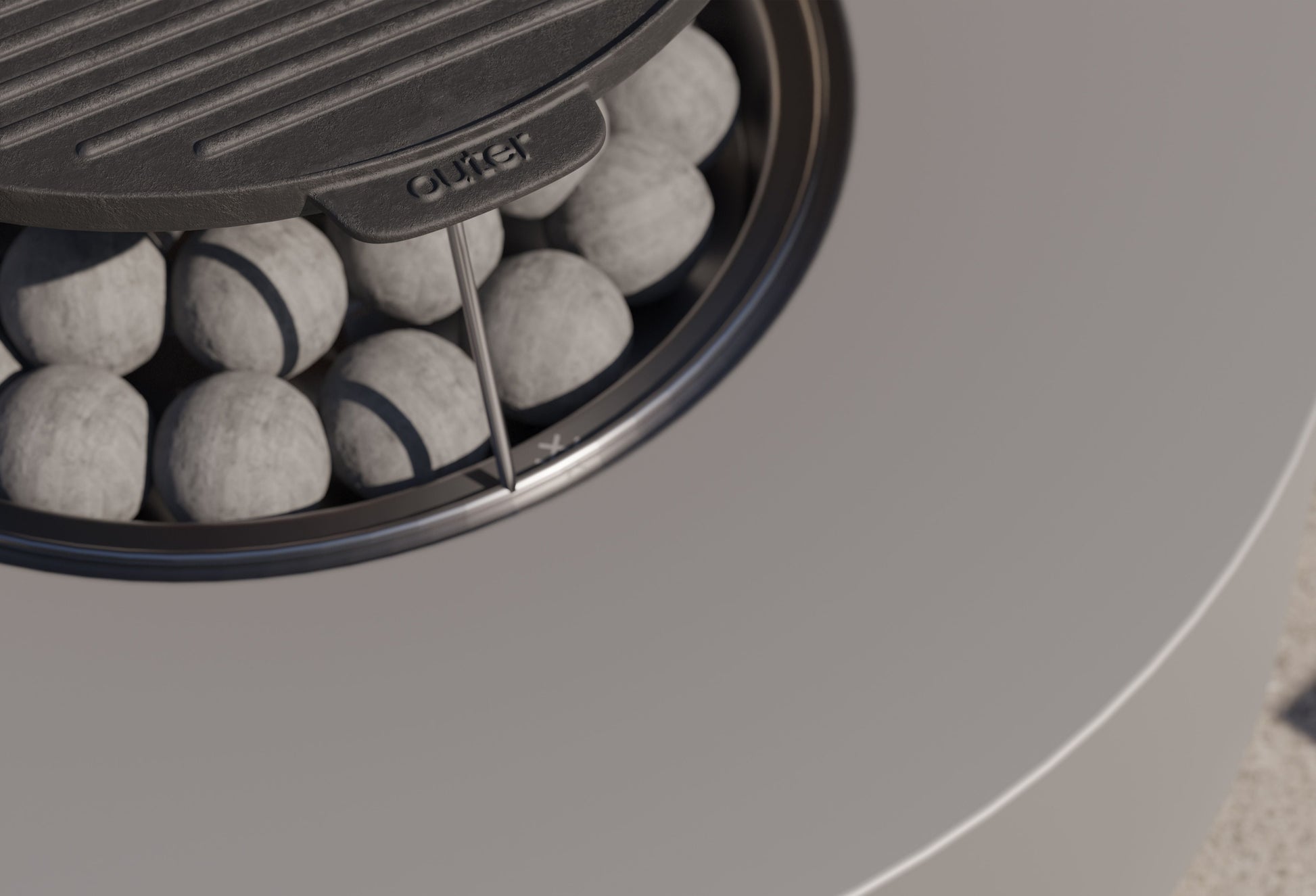 Close-up of the round cast iron griddle in position over the flame