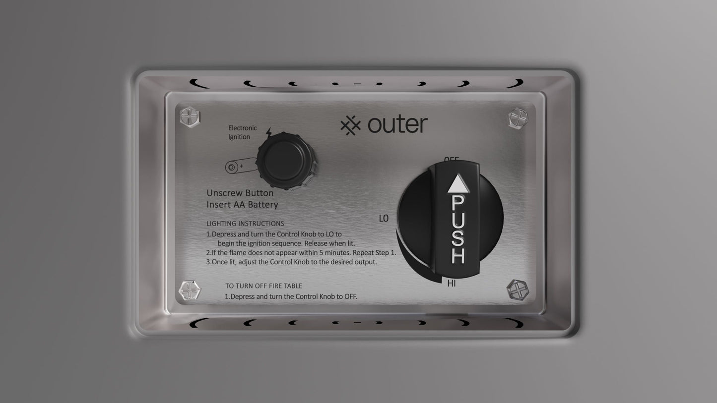 Close-up of the electronic ignition control knob on the concrete face plate