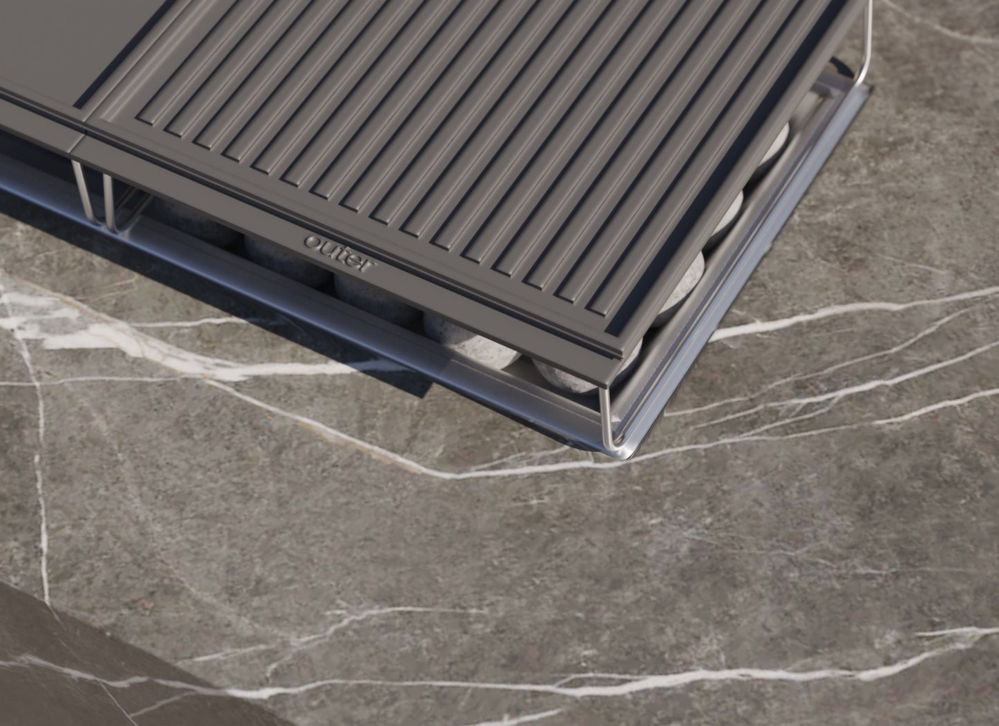 Close-up of the cast iron griddle and stand over the OuterStone burner pan